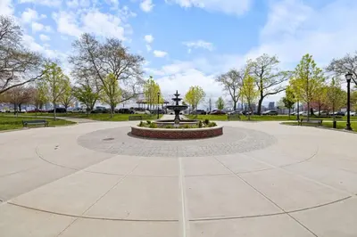 a fountain in the middle of a park at Luxury and Chic 2BR 2BA Apt Mins to NYC and Hoboken in Jersey City
