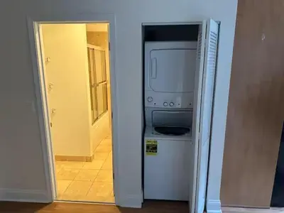 a kitchen with a refrigerator and a microwave at Philadelphia Studio in Philadelphia
