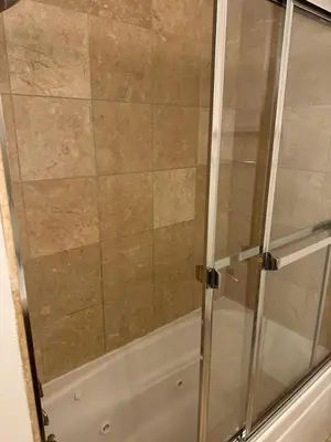 a shower with a glass door in a bathroom at Philadelphia Studio in Philadelphia