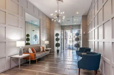 a living room with a couch and two chairs at Philadelphia Studio in Philadelphia
