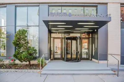 an entrance to a building with a revolving door at Blueground Jersey City EV charging nr park NYC-1690 in New York