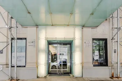 an entrance to a building with a revolving door at Blueground Upper West Side fitness center nr Central Park NYC-1596 in New York