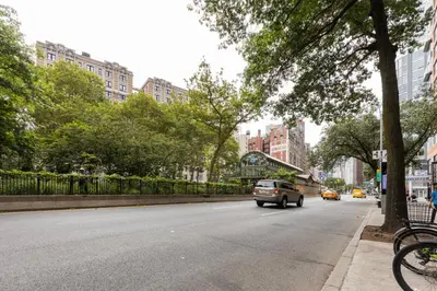 a car driving down a street in a city at Blueground Upper West Side fitness center nr Central Park NYC-1596 in New York