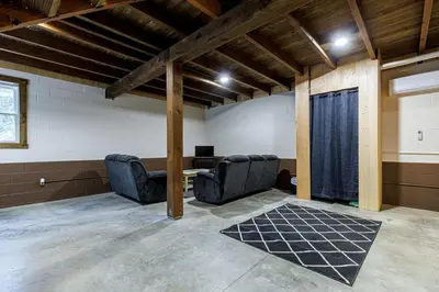 a room with two chairs and a desk in it at The River Shack - kayaks, fishing, quiet, family in Delta