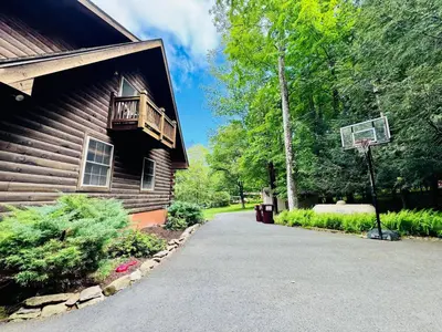 a basketball hoop on the side of a house at Lazy River Cabin: Lakefront Stay in Greentown