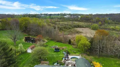 an aerial view of a field with a house at Honesdale Escape ~ A Place to Remember - Apartment in Honesdale