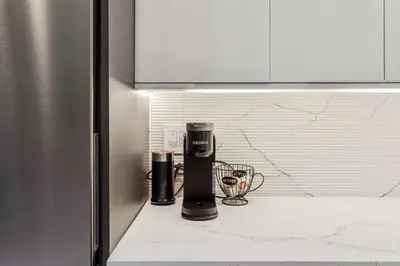 a kitchen counter with two coffee cups on it at 24 Stay - Philadelphia Rittenhouse in Philadelphia