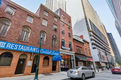 a brick building on a city street with tall buildings at 24 Stay - Philadelphia Rittenhouse in Philadelphia