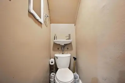 a small bathroom with a toilet and a sink at Charming Philly Stay Walk to Liberty Bell & More in Philadelphia