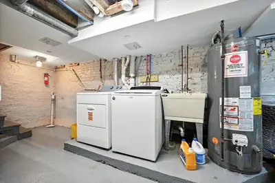 a garage with two refrigerators in a room at Heart of Downtown Delight in Philadelphia