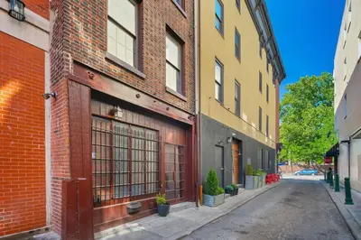 an empty street in an alley between buildings at Heart of Downtown Delight in Philadelphia