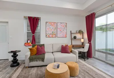 a living room with a couch and a table at Travelers Dream that's Mins to NYC having Game Room and Parking in Jersey City