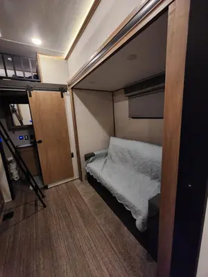 a small room with a bed and a door at Luxury Lakeside Retreat - The Cozy Wondrous Weekendator in Lake Ariel