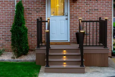 a house with a staircase with lights in front of a door at Amish Guest House - hottub, patio, swing, ebikes in Gordonville