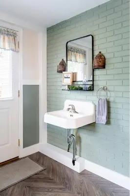 a bathroom with a sink and a mirror at Amish Guest House - hottub, patio, swing, ebikes in Gordonville