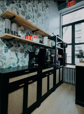 a kitchen with a counter in a room at CityNest Hotel in New York