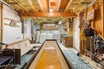 a living room with a couch and a table at Vaulted Pines Lodge Hot Tub Game Room in Albrightsville