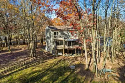 an aerial view of a house in the woods at Vaulted Pines Lodge Hot Tub Game Room in Albrightsville