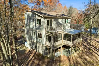an aerial view of a house in the woods at Vaulted Pines Lodge Hot Tub Game Room in Albrightsville