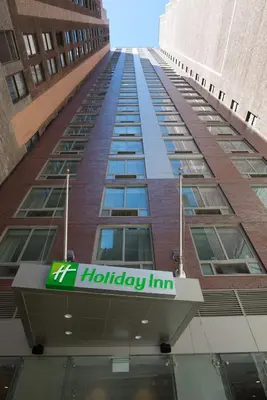 a building with a holiday inn sign on it at Holiday Inn New York City - Times Square by IHG in New York