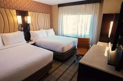 a hotel room with two beds and a window at Holiday Inn New York City - Times Square by IHG in New York