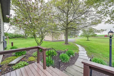 a wooden deck with a walkway leading to a park at Near State Parks Countryside Cottage in Wellsboro in Wellsboro
