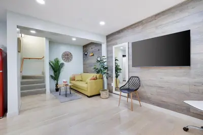 a living room with a flat screen tv on a wall at Apartment Minutes from Camelback Mountain with Washer Dryer in Tannersville