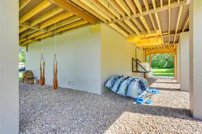 a barn with a wooden ceiling and a room with a bed at Steps to Susquehanna River Hot Tub Hideaway! in Dauphin