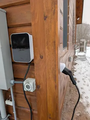 a tv on the side of a house at Fully Loaded Riverfront West Branch Fishing Cabin in Deposit