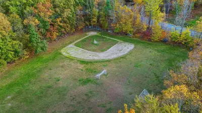 an aerial view of a garden with a stone circle in the grass at Access to Private Lake Pools Sports Complex • Fire Pit Foxden by AvantStay in East Stroudsburg