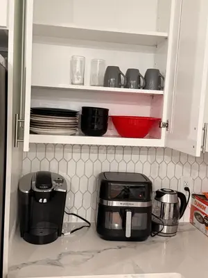 a kitchen counter with a toaster and a toaster oven at E&G homes in East Orange