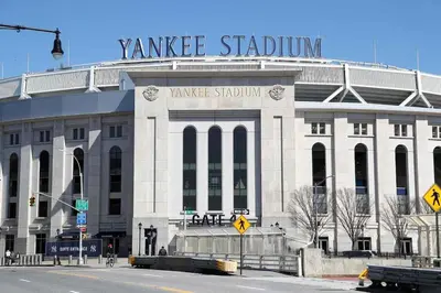 a large white building with a sign on top of it at Peaceful Hideaway - NYC & NWK with free parking in Newark