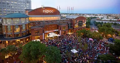 a large crowd of people in front of a building at Peaceful Hideaway - NYC & NWK with free parking in Newark