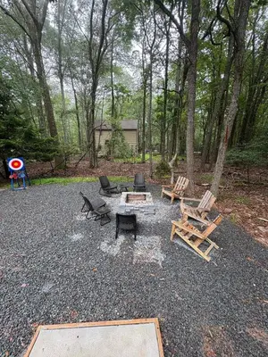 a group of picnic tables and chairs in a park at Renovated 6 bed Hot Tub Sauna Firepit & Beach in Lake Harmony