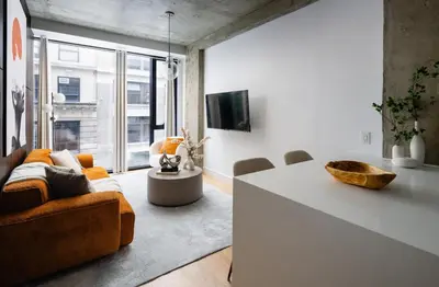a living room with a couch and a table at Stunning Apartment in Manhattan with Patio in New York