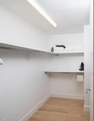 a white room with a shelf in the ceiling at Stunning Apartment in Manhattan with Patio in New York