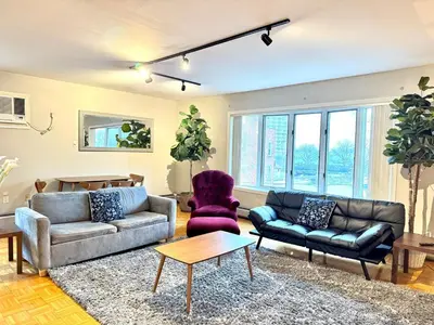 a living room with a couch and two chairs at Spacious and Convinient near NYC Parking Available in Guttenberg