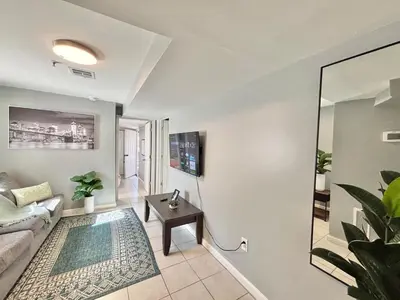 a living room with a couch and a table at FREE Parking Cozy 2 Bedroom unit near NYC in North Bergen