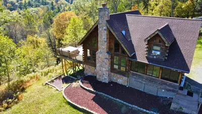 an overhead view of a house in the woods at Rustic Ridge Log Cabin: Hot Tub, Games, Views! in Mount Pocono