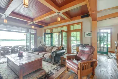 a living room with a couch and a coffee table at Luxe Family Home on Orange Lake with Private Dock! in Newburgh