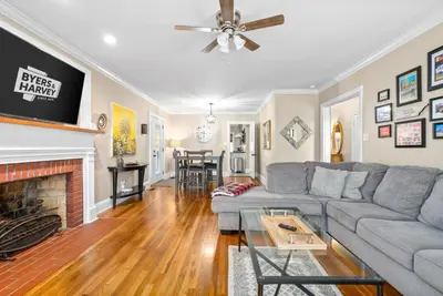 a living room with a couch and a fireplace at 3BD 102 Madison Ter in Springfield