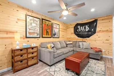 a living room with a couch and a ceiling fan at 3BD 102 Madison Ter in Springfield