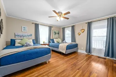 a bedroom with two beds and a ceiling fan at 3BD 102 Madison Ter in Springfield