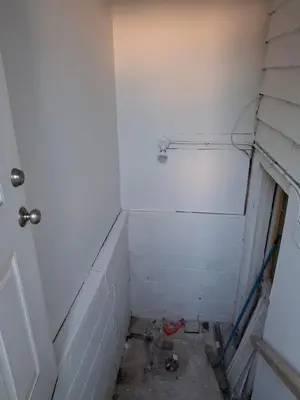 a corner of a bathroom with a white wall at Quiet Harrisburg home in Harrisburg