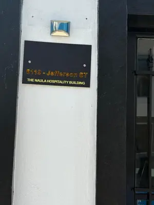 a sign on the side of a building at 15 mins to NYC-Great Apartment Great for Family in West New York