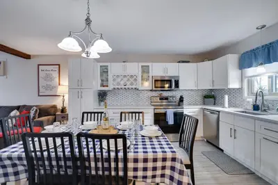 a kitchen and dining room with a table and chairs at The Cozy Peak 5 Minutes to Ski in Tannersville