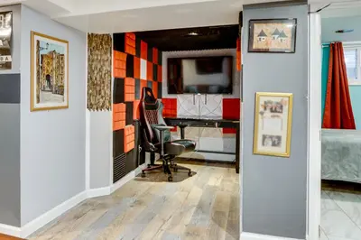 an office with a desk and a chair in a room at Apt 2 Mi to Prudential Center and Dtwn Newark! in Newark