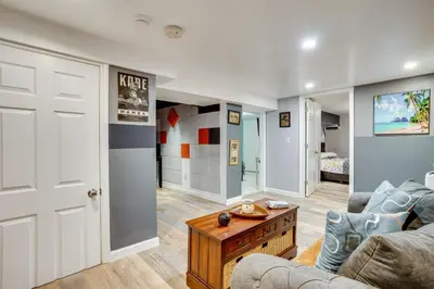 a living room with a couch and a table at Apt 2 Mi to Prudential Center and Dtwn Newark! in Newark