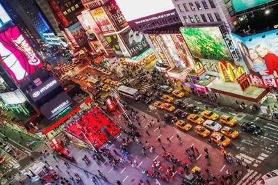 an overhead view of a busy city street with taxis at Private room by Times Square Manhattan in New York