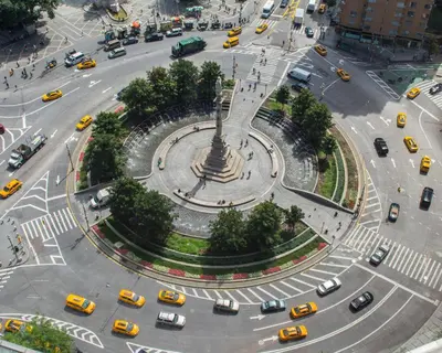 an aerial view of a busy city intersection with cars at Private room by Times Square Manhattan in New York
